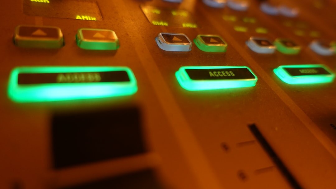 Vision mixer control panel with glowing buttons