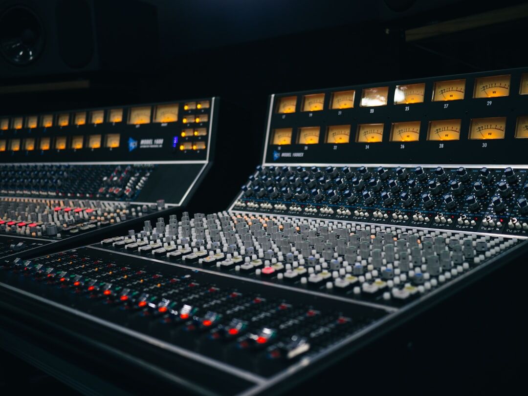 Sound engineer mixing audio on a broadcast console