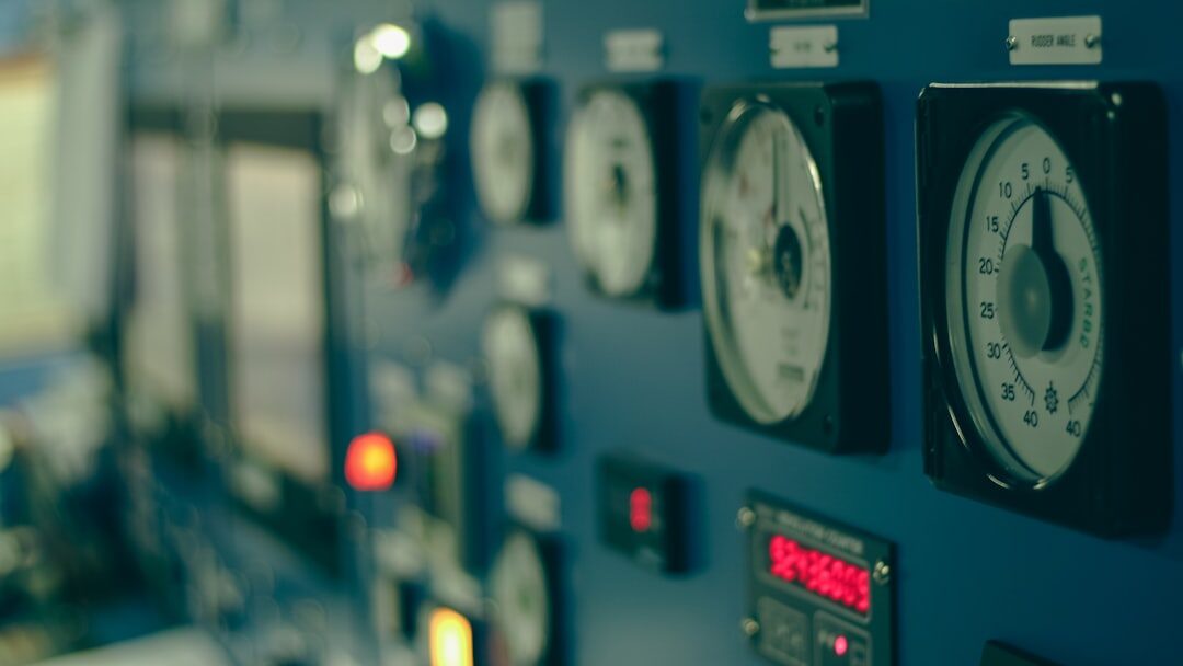 Broadcast control room with monitors and mixing desks