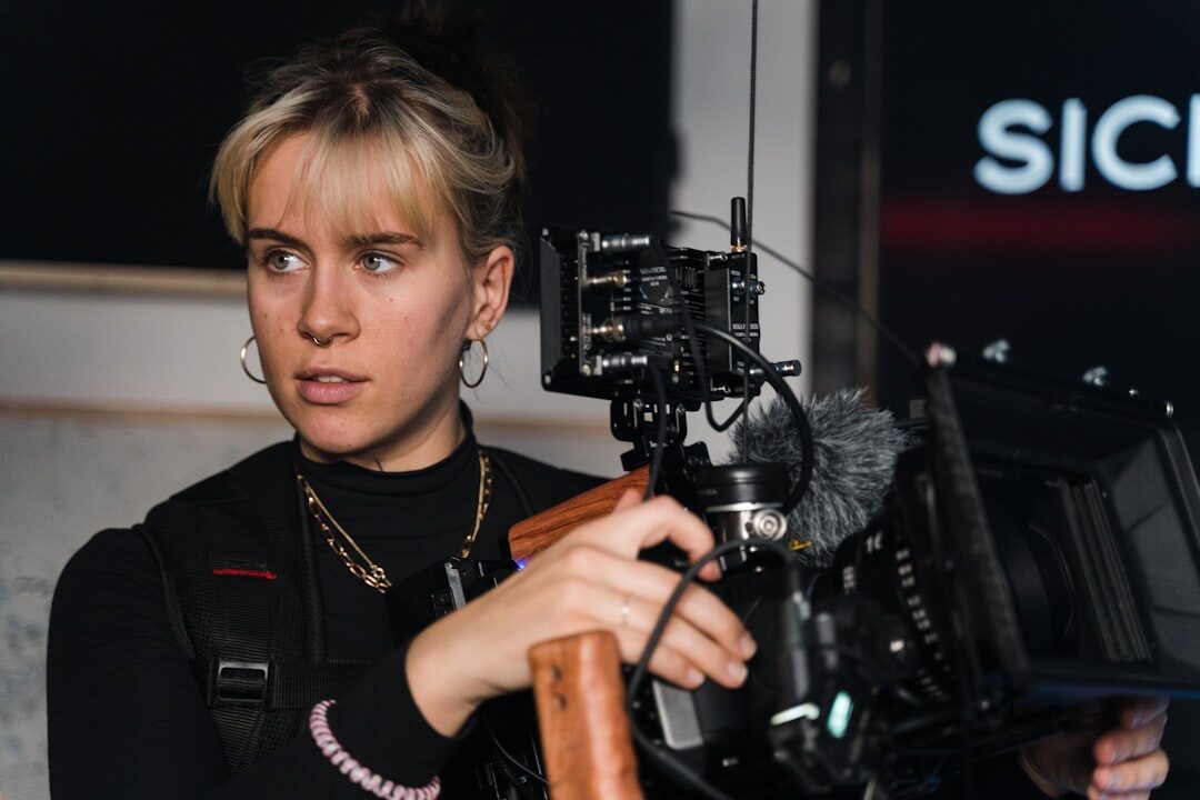 Finnish woman camera operator holding a broadcast camera