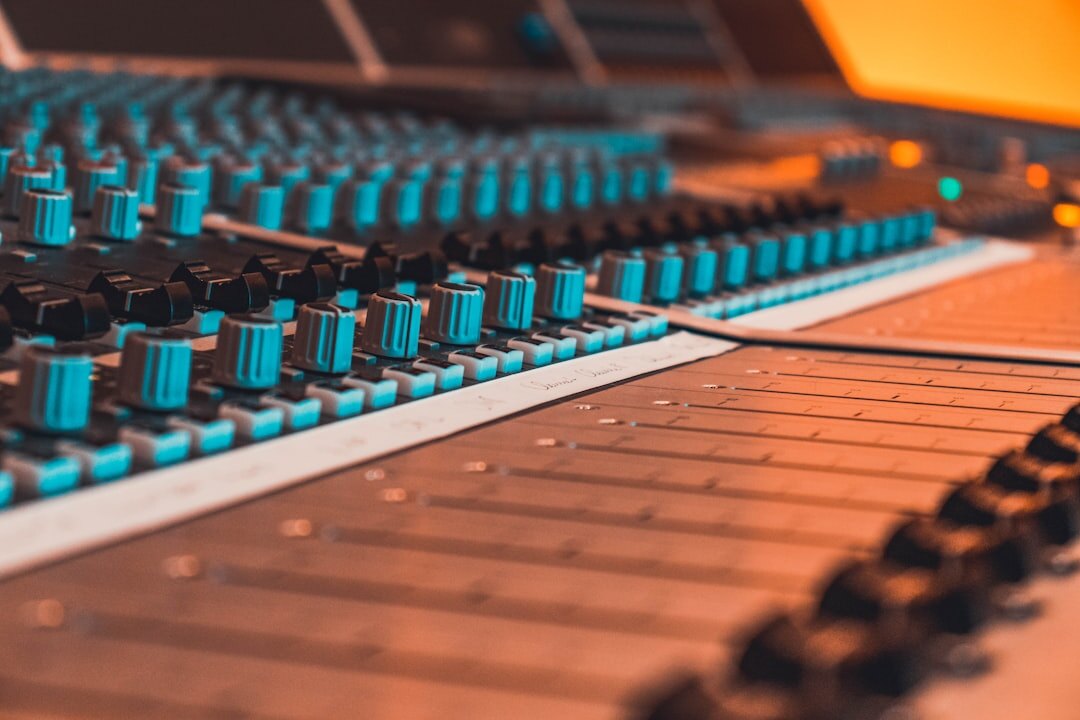 Sound engineer monitoring audio waveforms during a live broadcast