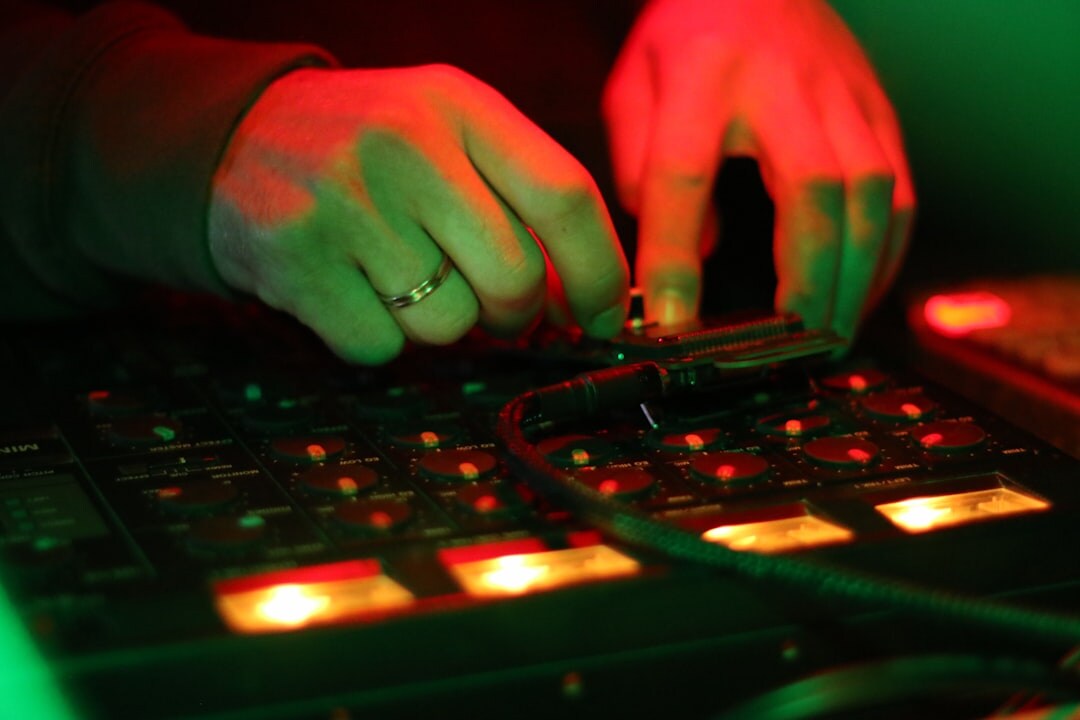 Lighting designer adjusting moving head lights from a control desk