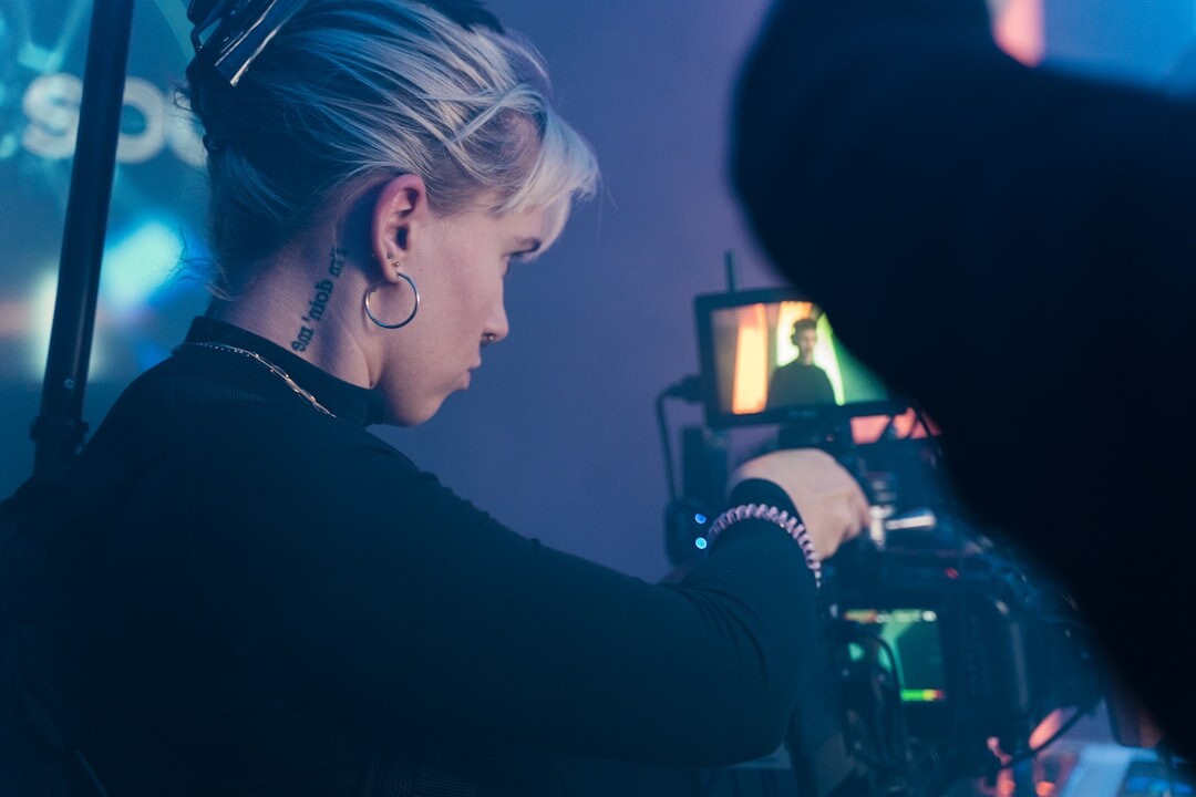 Camera operator filming a live television show in a studio